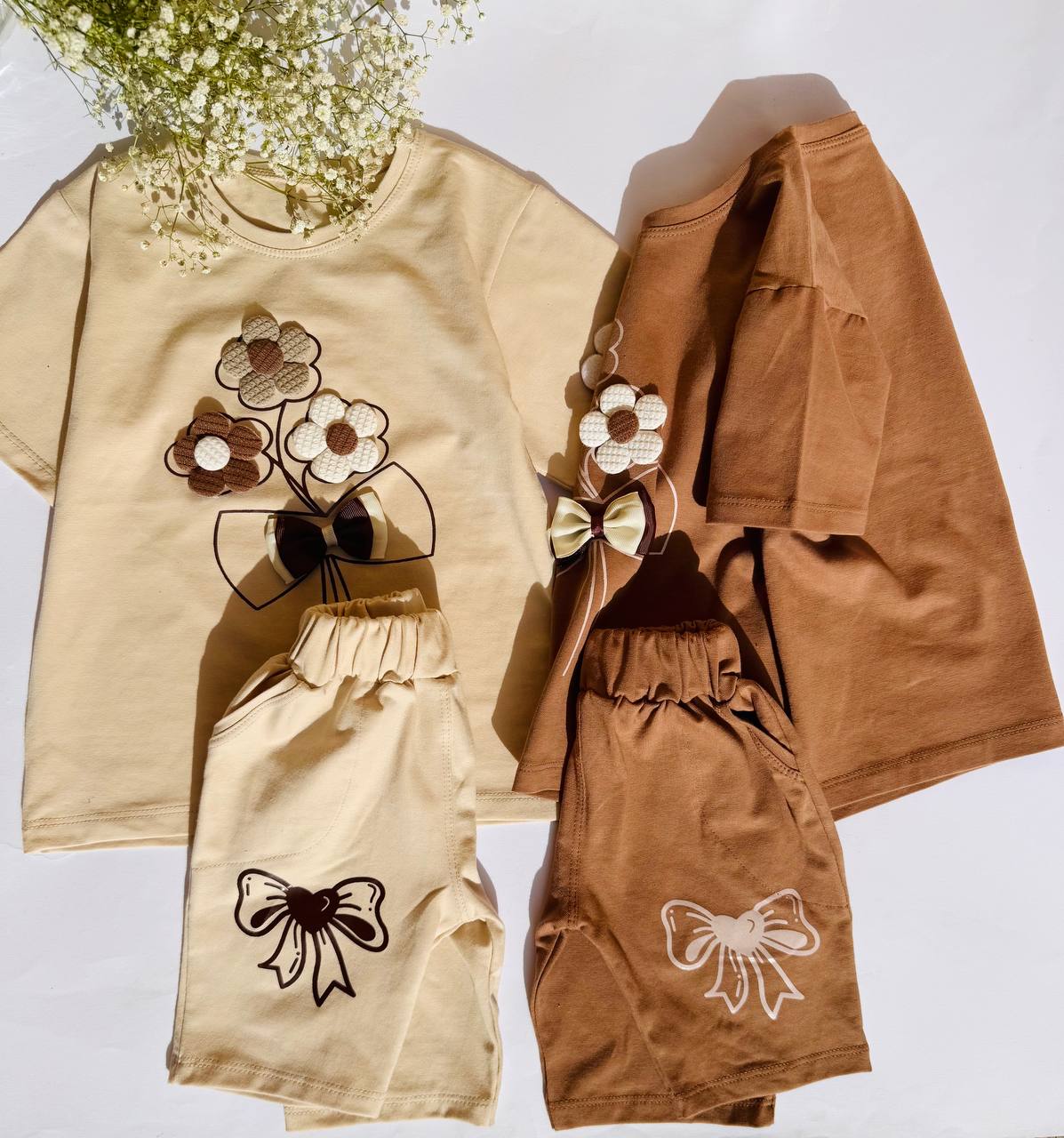 لباس  ست دو تکه تیشرت شلوارک دخترانه پاپیون با گل های برجسته سایز 40 و 45
